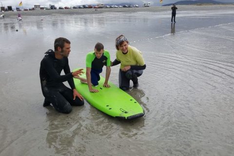 Igor taking a suft lesson during his first time braving the sea